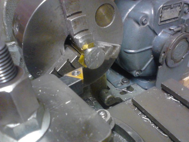 Dovetail cutter chucked with brass shims
